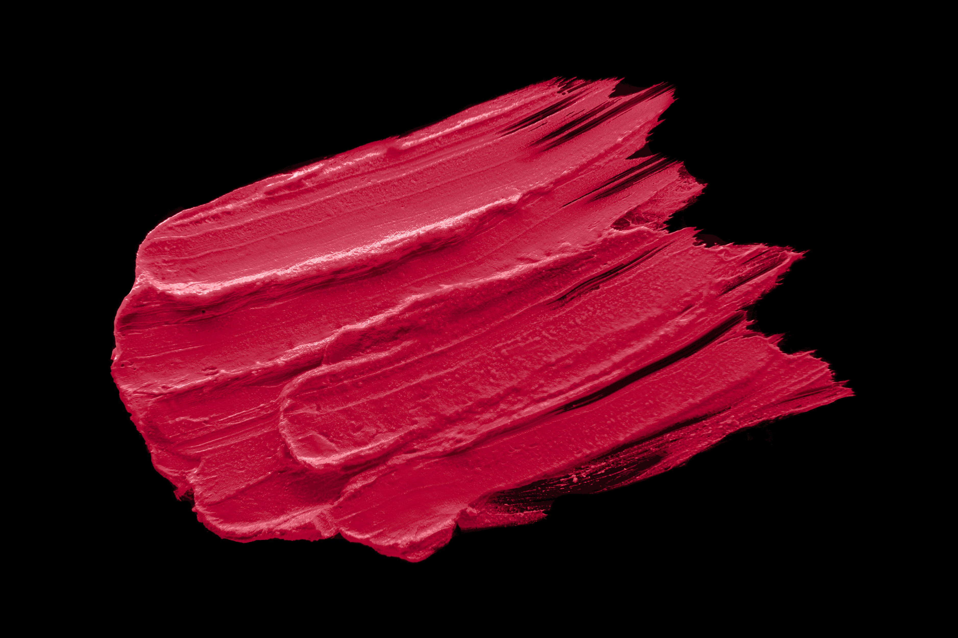 A close-up of Retro Silk-Matte Lipstick in Rose Pink, showcasing its smooth texture and vibrant color in a sleek tube.