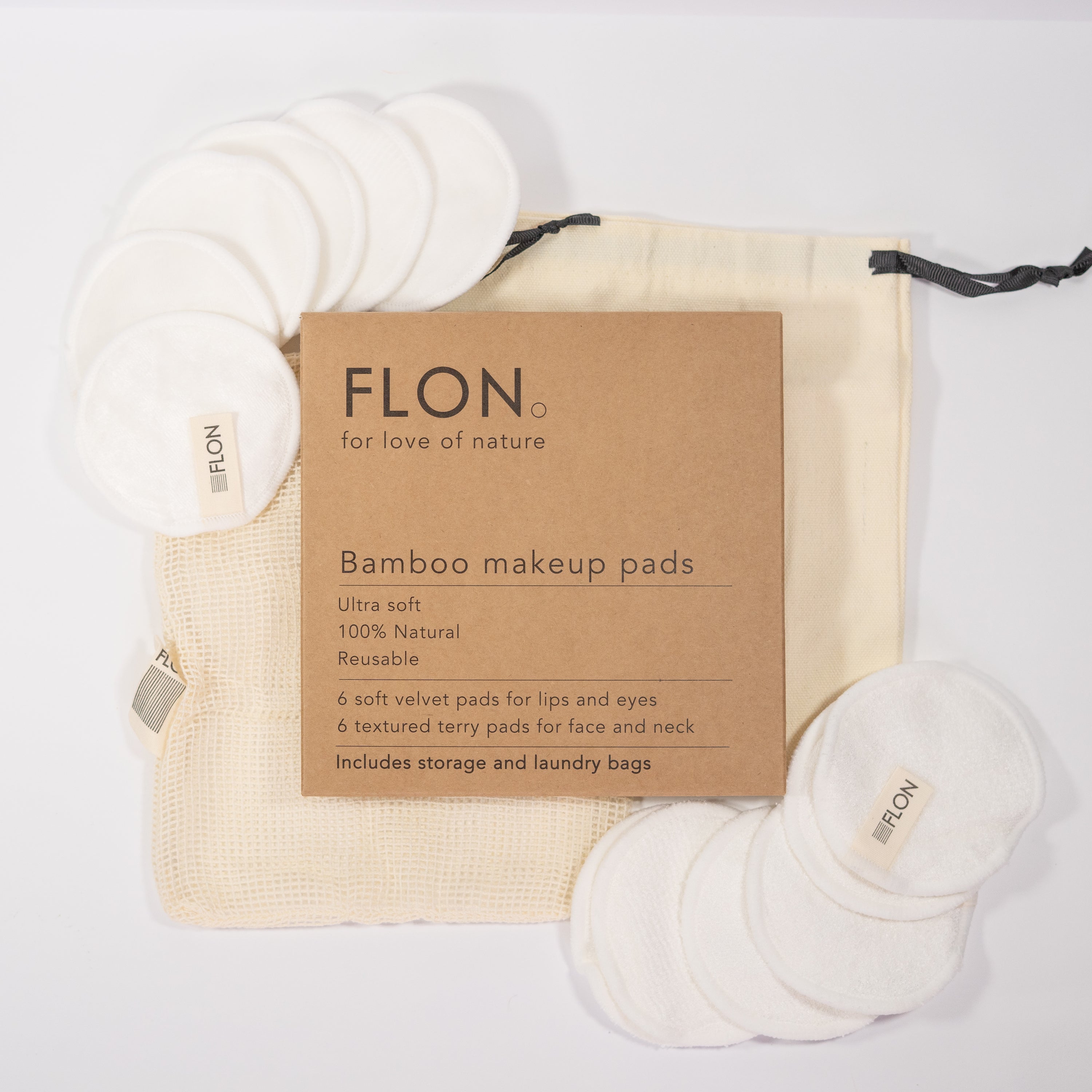 Set of 12 reusable bamboo makeup remover pads with a mesh laundry bag, showcasing soft velvet and textured terry cloth options.