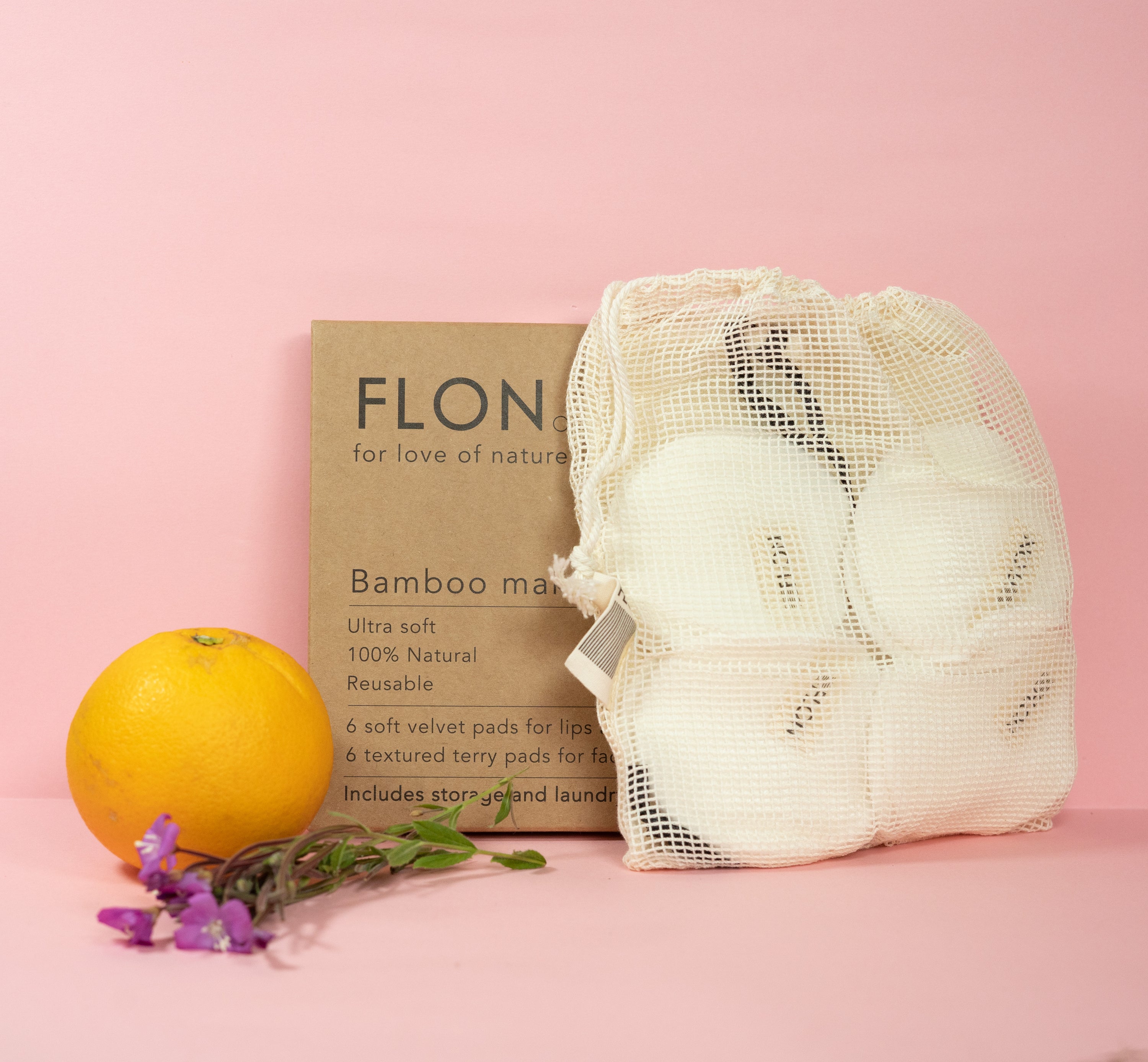 Set of 12 reusable bamboo makeup remover pads with a mesh laundry bag, showcasing soft velvet and textured terry cloth options.