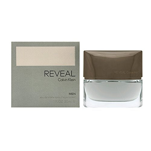 Reveal Men Eau de Toilette by Calvin Klein in a sleek bottle, showcasing its modern design and aromatic fragrance.