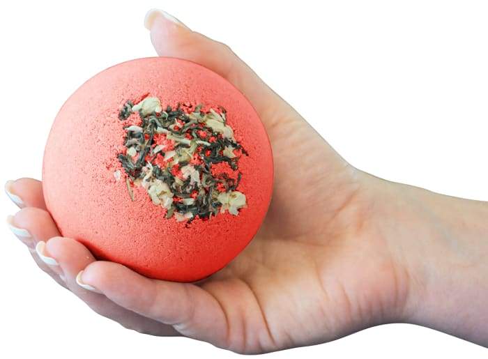 Romance - Bomb Core bath bomb with floral design and essential oils, revealing goat milk soap inside.