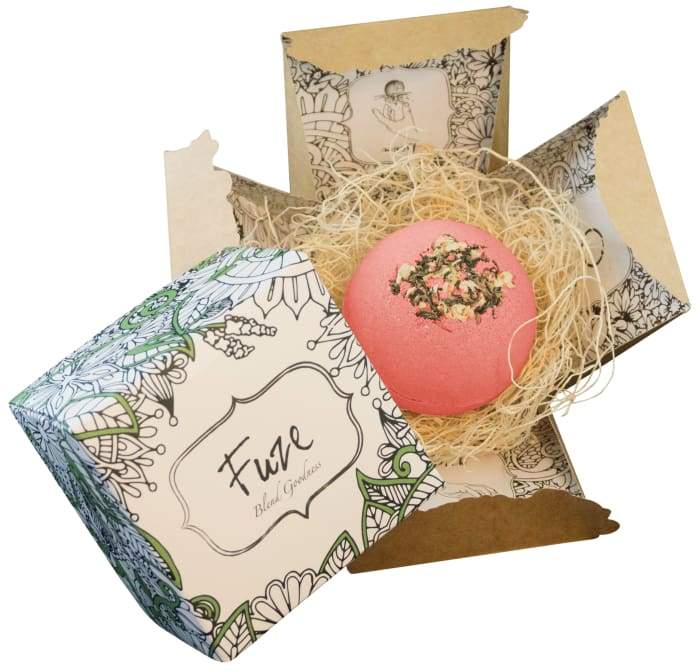 Romance - Bomb Core bath bomb with floral design and essential oils, revealing goat milk soap inside.