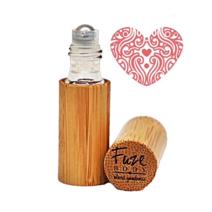 A roll-on bottle of Romance Wood Pure Essential Oils featuring Jasmine and pheromones, designed for sensuality and skin safety.