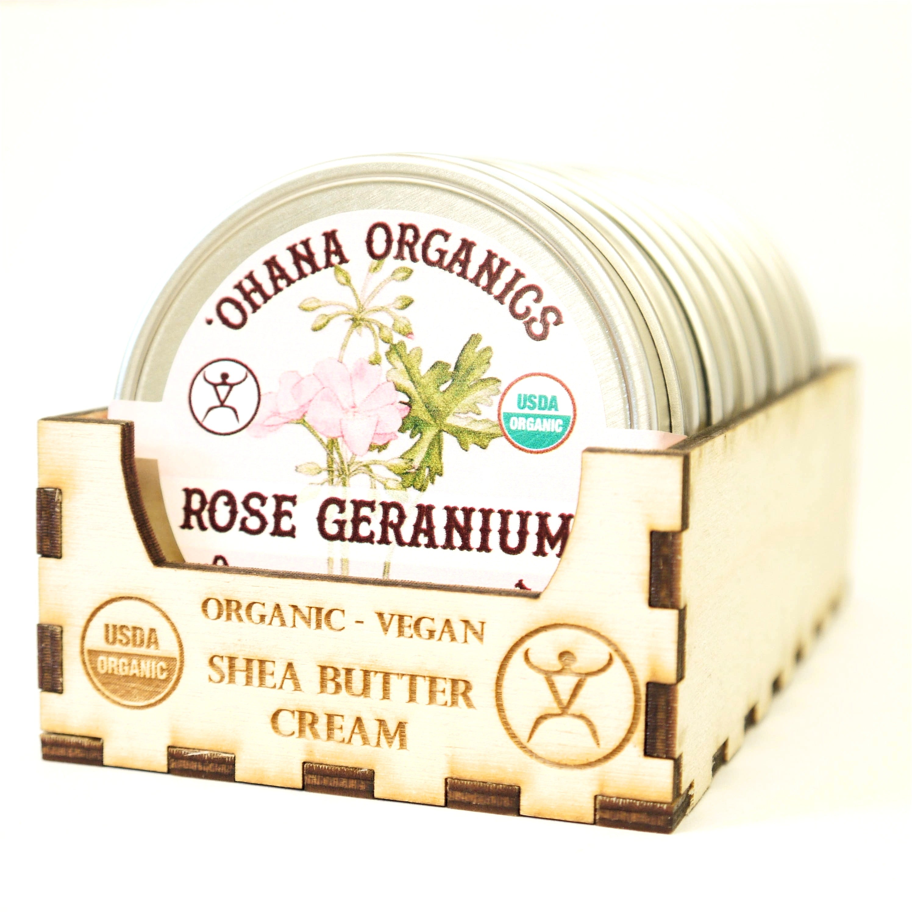 A jar of Rose Geranium Organic Shea Butter Cream with a floral design, showcasing its creamy texture and organic ingredients.