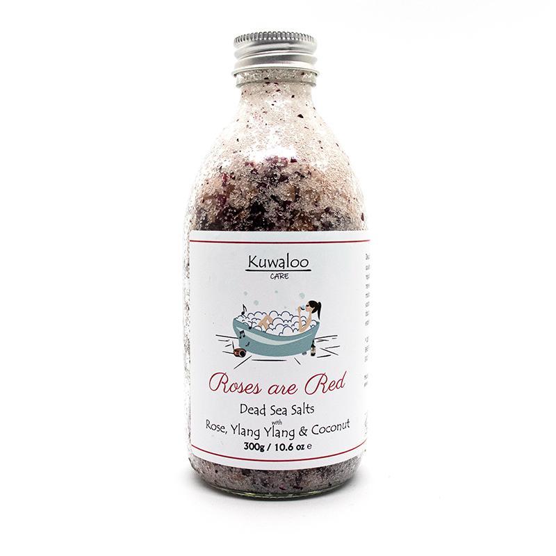 A jar of 'Roses are Red' Organic Bath Salts, showcasing its natural ingredients and beautiful packaging, perfect for a relaxing bath experience.