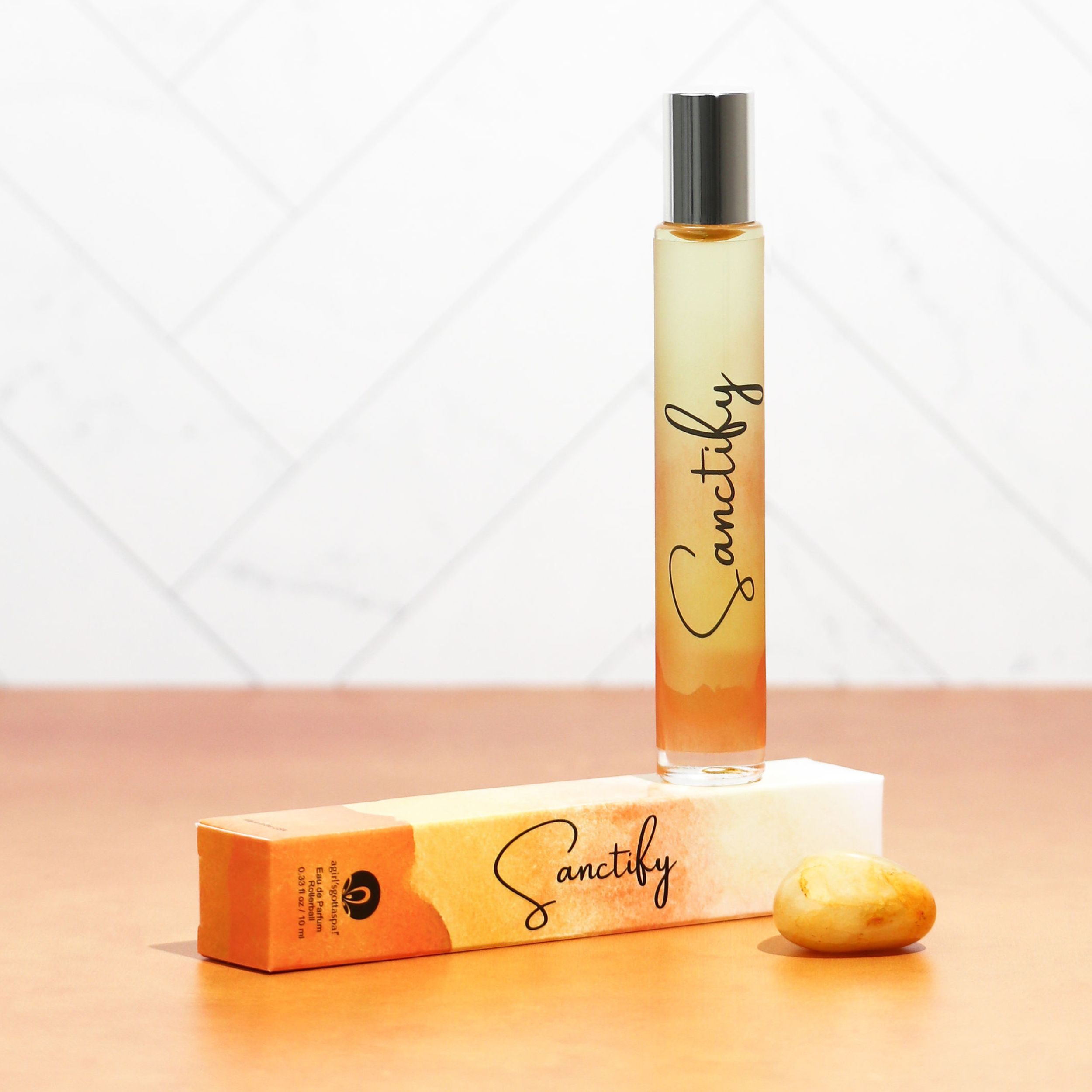 Sanctify Rollerball Perfume featuring a sleek design with Palo Santo fragrance notes, perfect for travel and gifting.