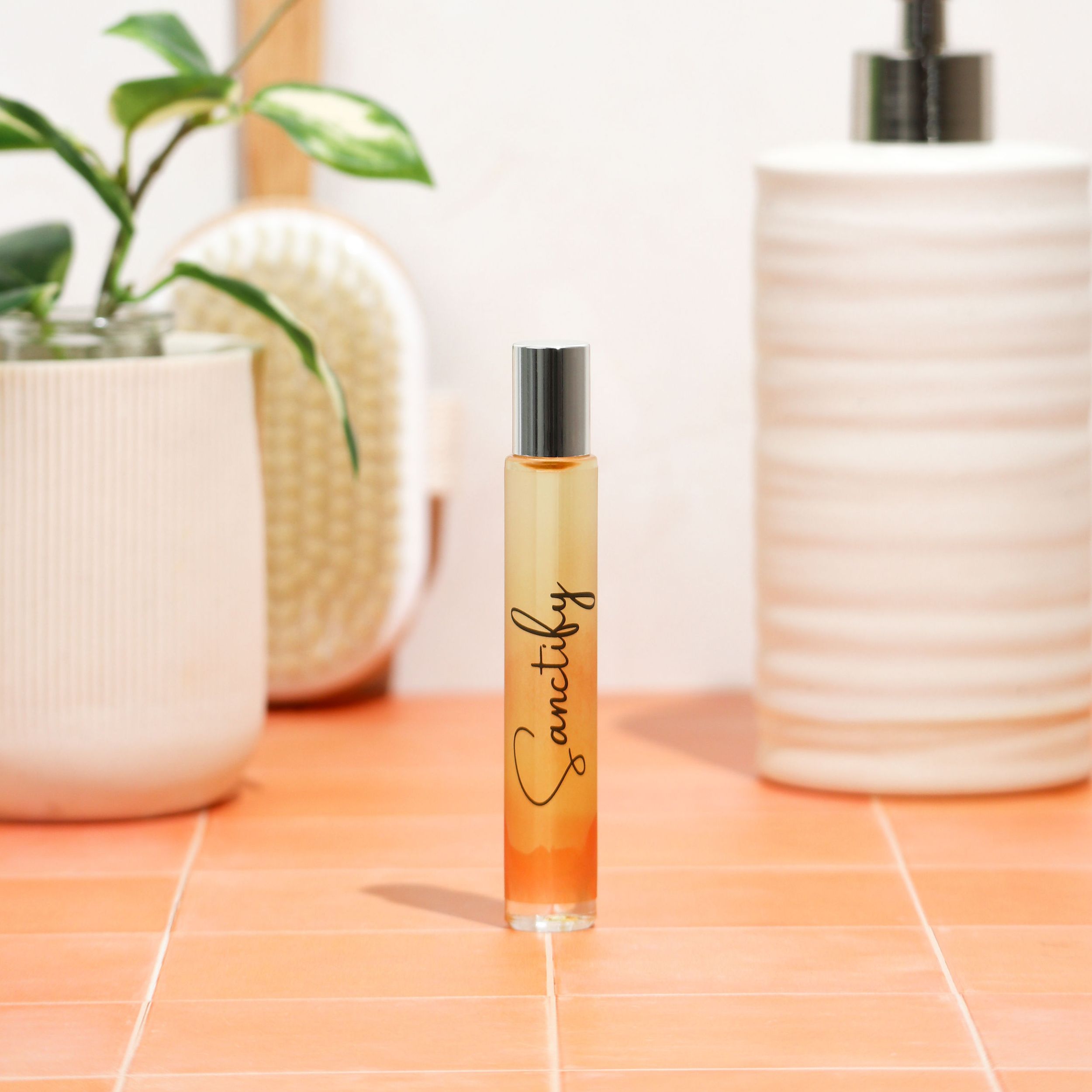 Sanctify Rollerball Perfume featuring a sleek design with Palo Santo fragrance notes, perfect for travel and gifting.