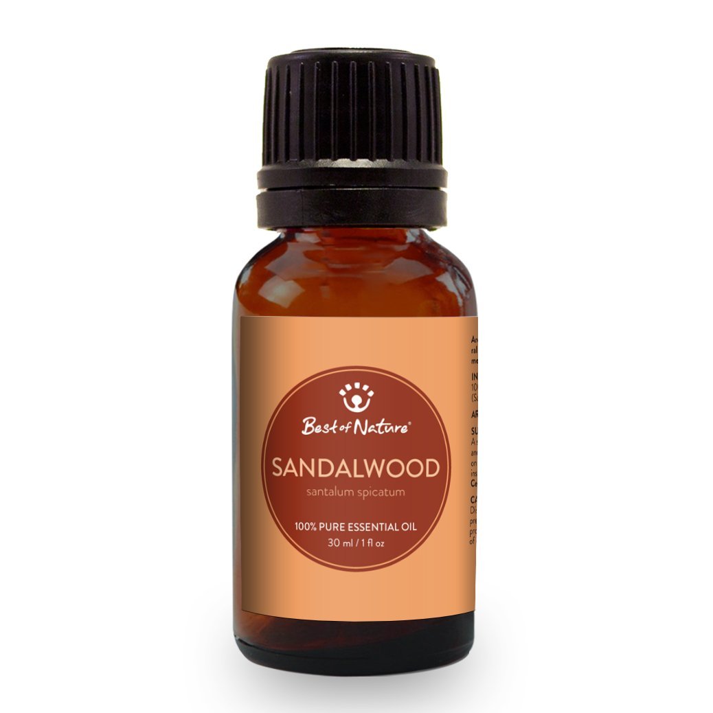 A bottle of Sandalwood Essential Oil with a wooden background, showcasing its rich amber color and elegant packaging.