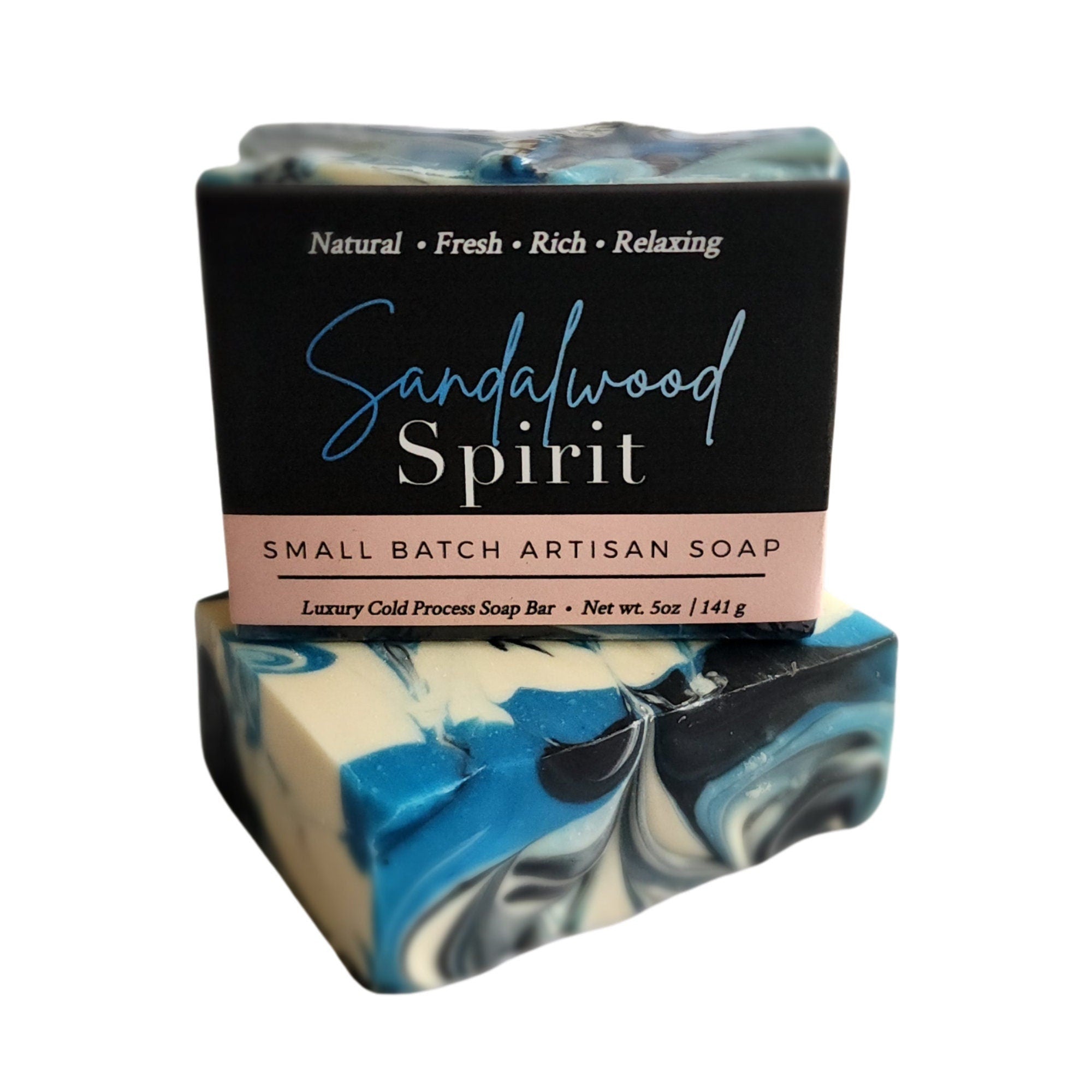 Sandalwood Spirit Soap bar with rich blue swirls, activated charcoal, and kaolin clay, showcasing its unique handcrafted design.