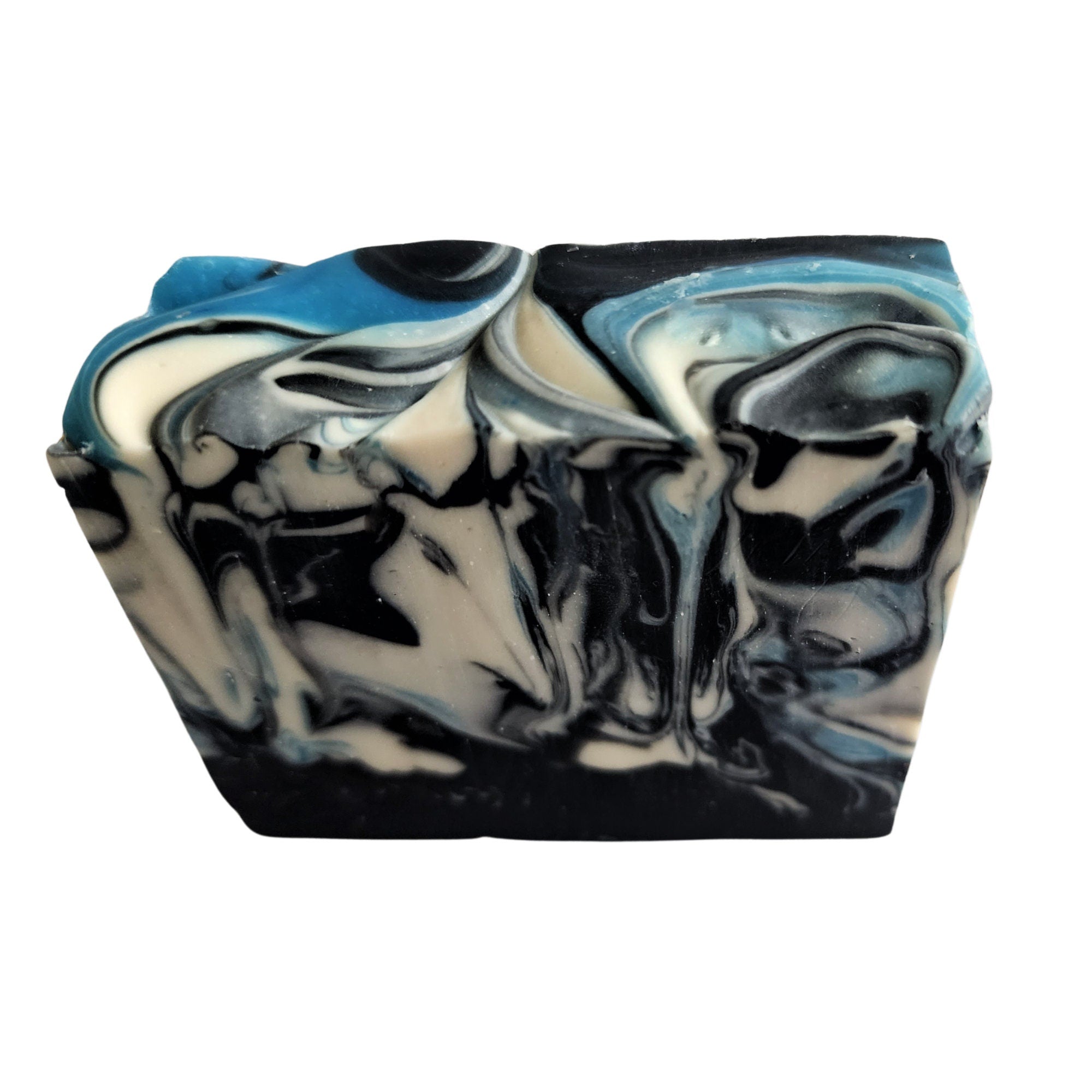 Sandalwood Spirit Soap bar with rich blue swirls, activated charcoal, and kaolin clay, showcasing its unique handcrafted design.