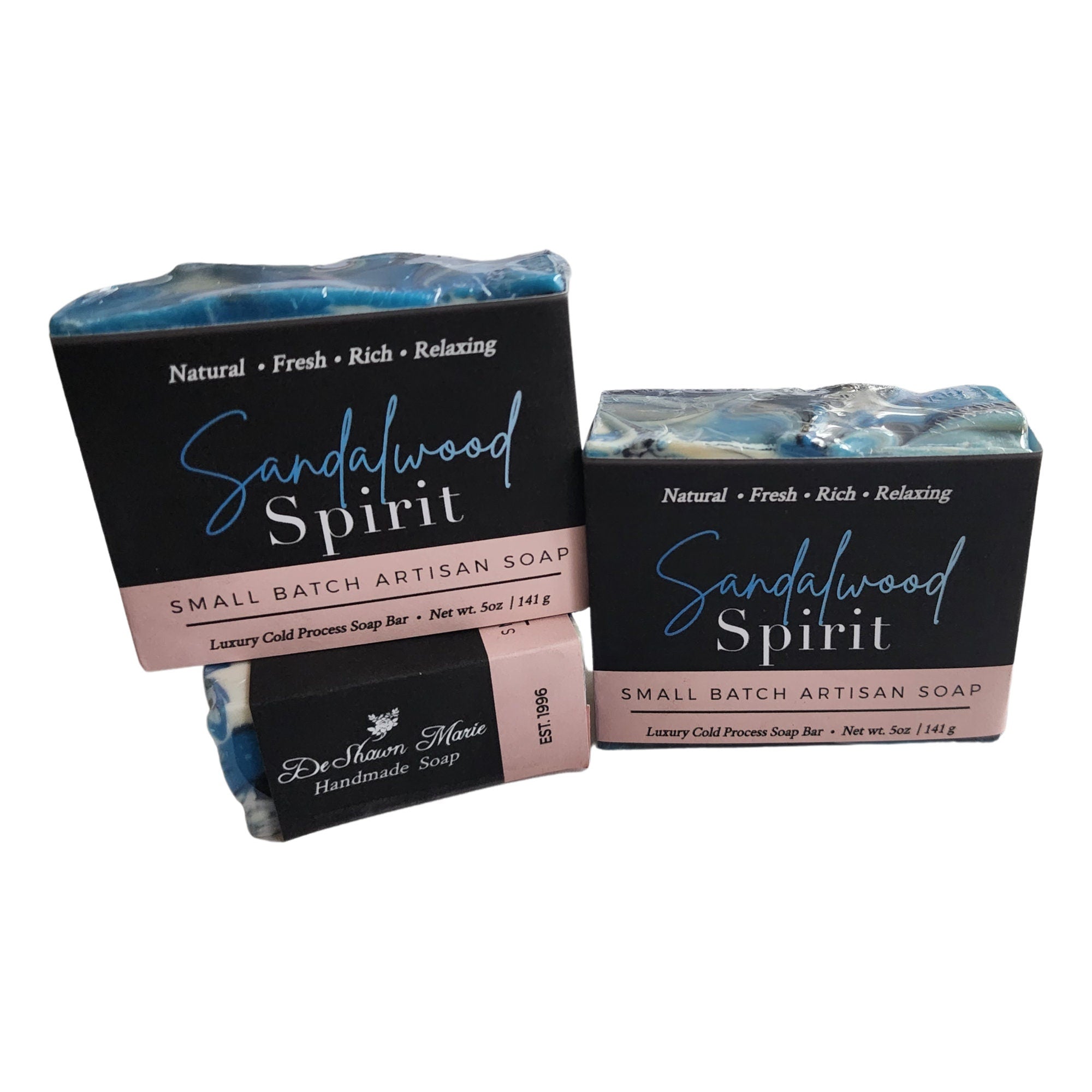 Sandalwood Spirit Soap bar with rich blue swirls, activated charcoal, and kaolin clay, showcasing its unique handcrafted design.