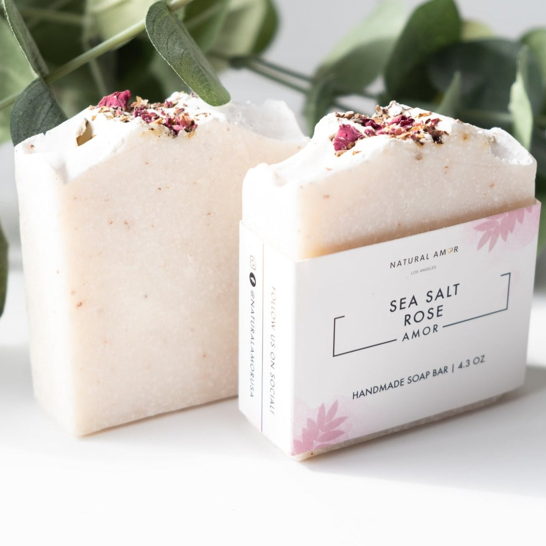 A beautifully crafted Sea Salt Rose Soap Bar with pink hues, showcasing rose petals and a smooth texture, perfect for exfoliating and nourishing the skin.