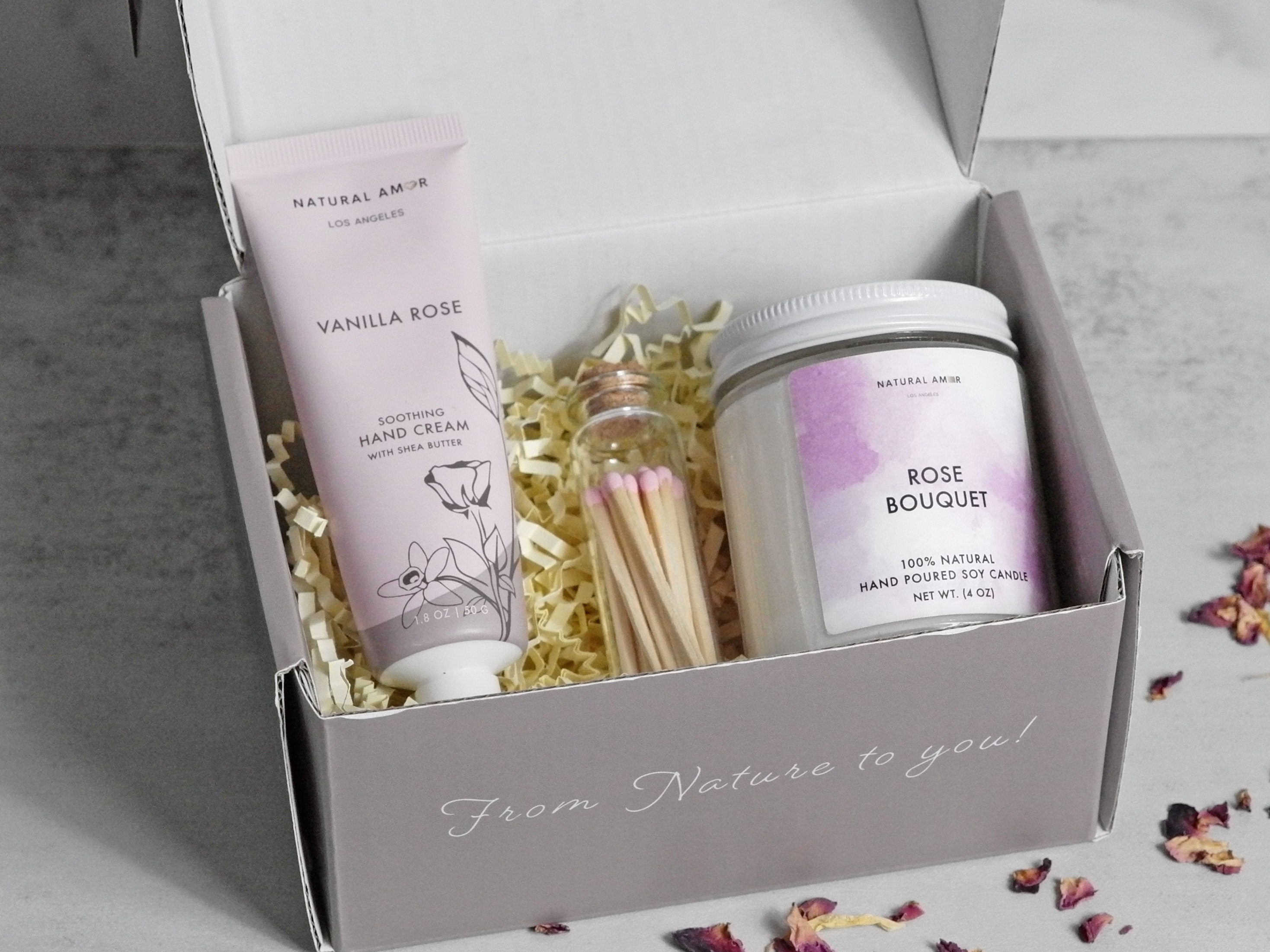 Sending Hugs Relaxation Gift Set featuring a soy wax candle, matches in a bottle, and vanilla rose hand cream in a stylish gift box.