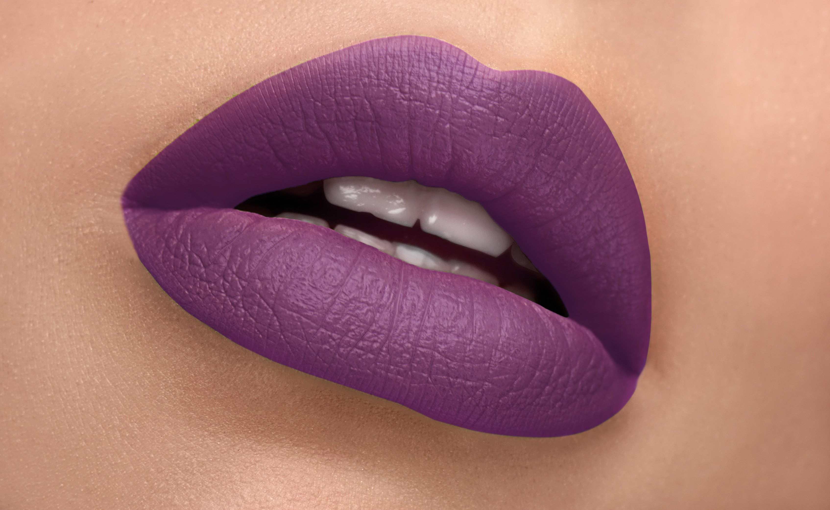 Sensation Silk-Matte Lipstick in Magenta Purple, showcasing its luxurious packaging and vibrant color.