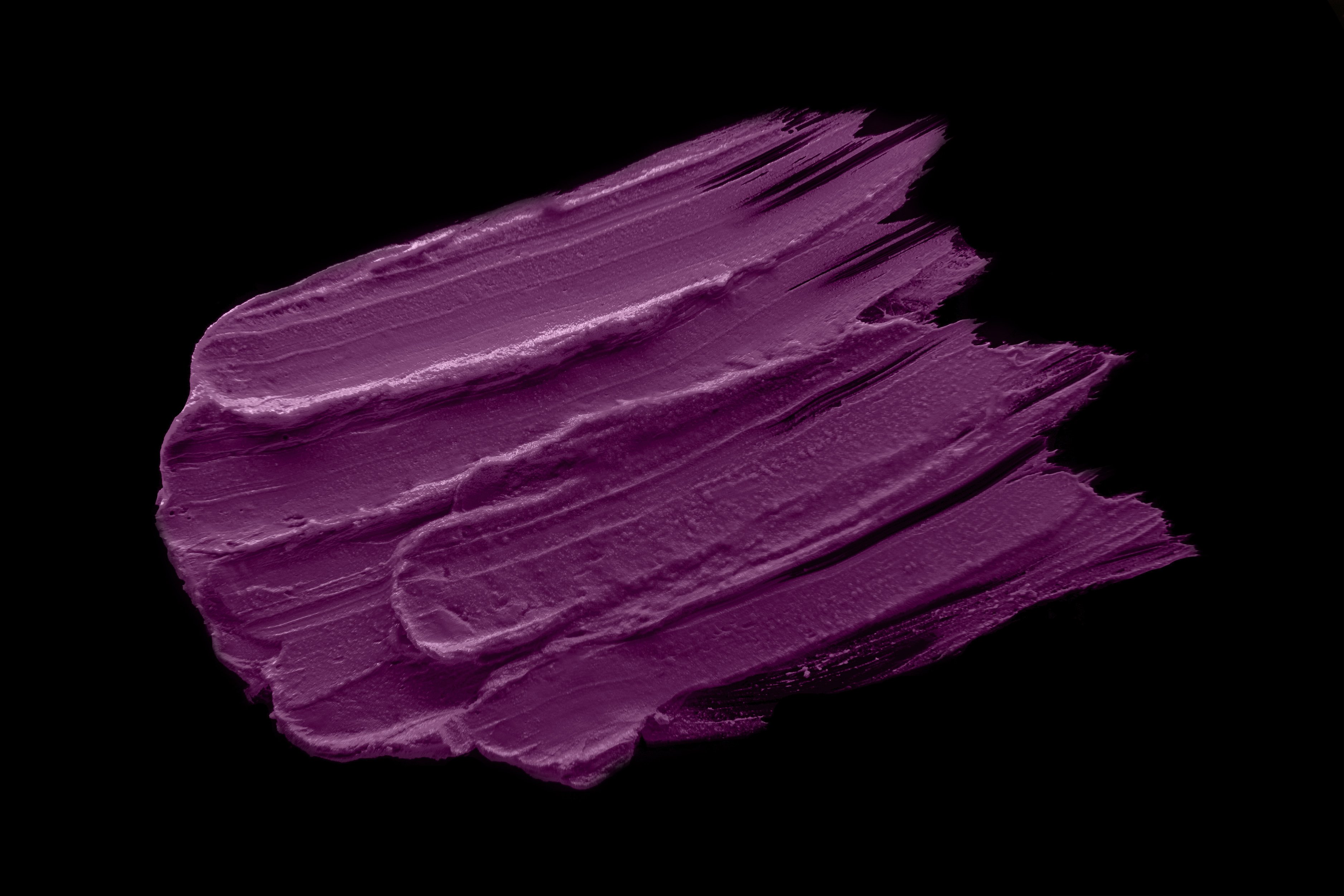 Sensation Silk-Matte Lipstick in Magenta Purple, showcasing its luxurious packaging and vibrant color.