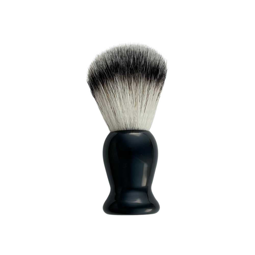 A stylish Shave Brush available in Black, Red, and White, featuring soft vegan bristles for a luxurious shaving experience.