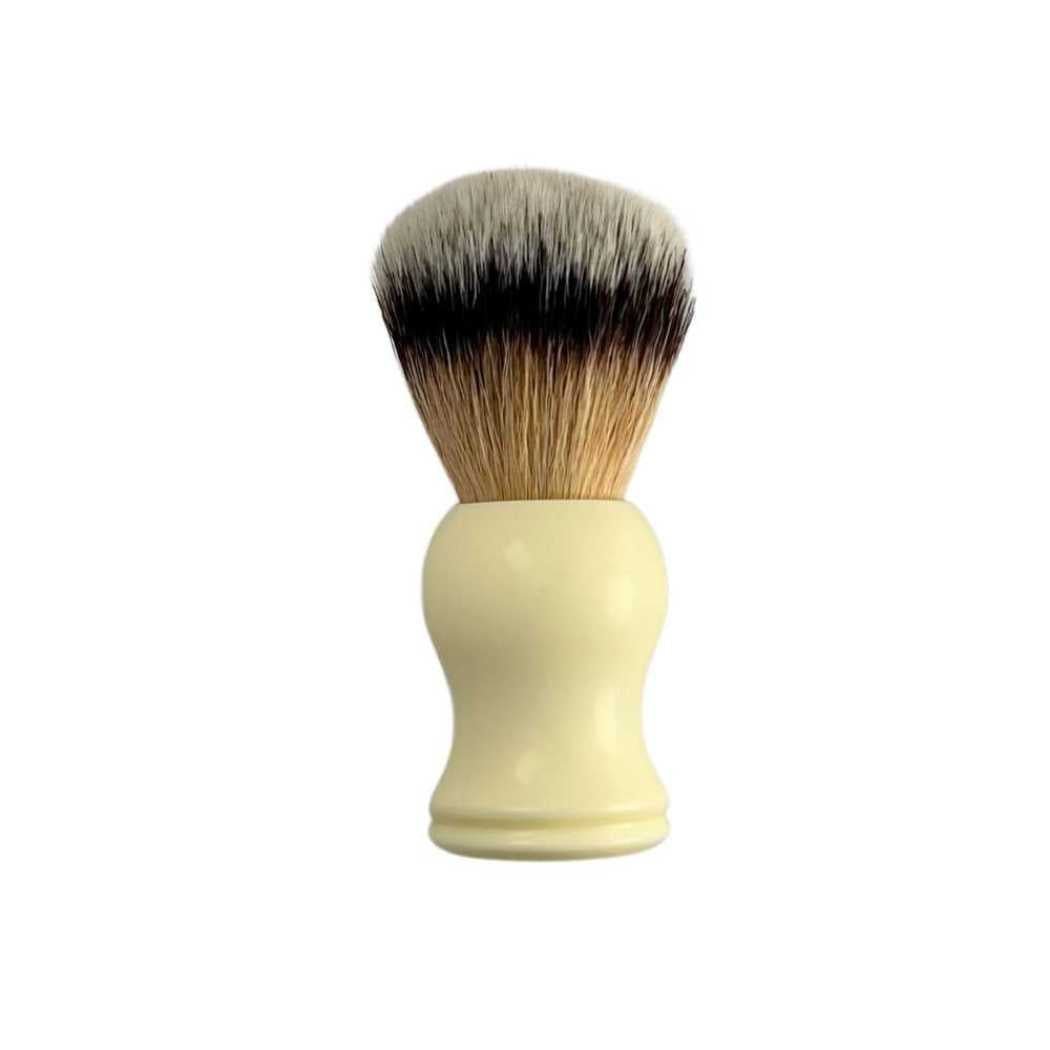 A stylish Shave Brush available in Black, Red, and White, featuring soft vegan bristles for a luxurious shaving experience.