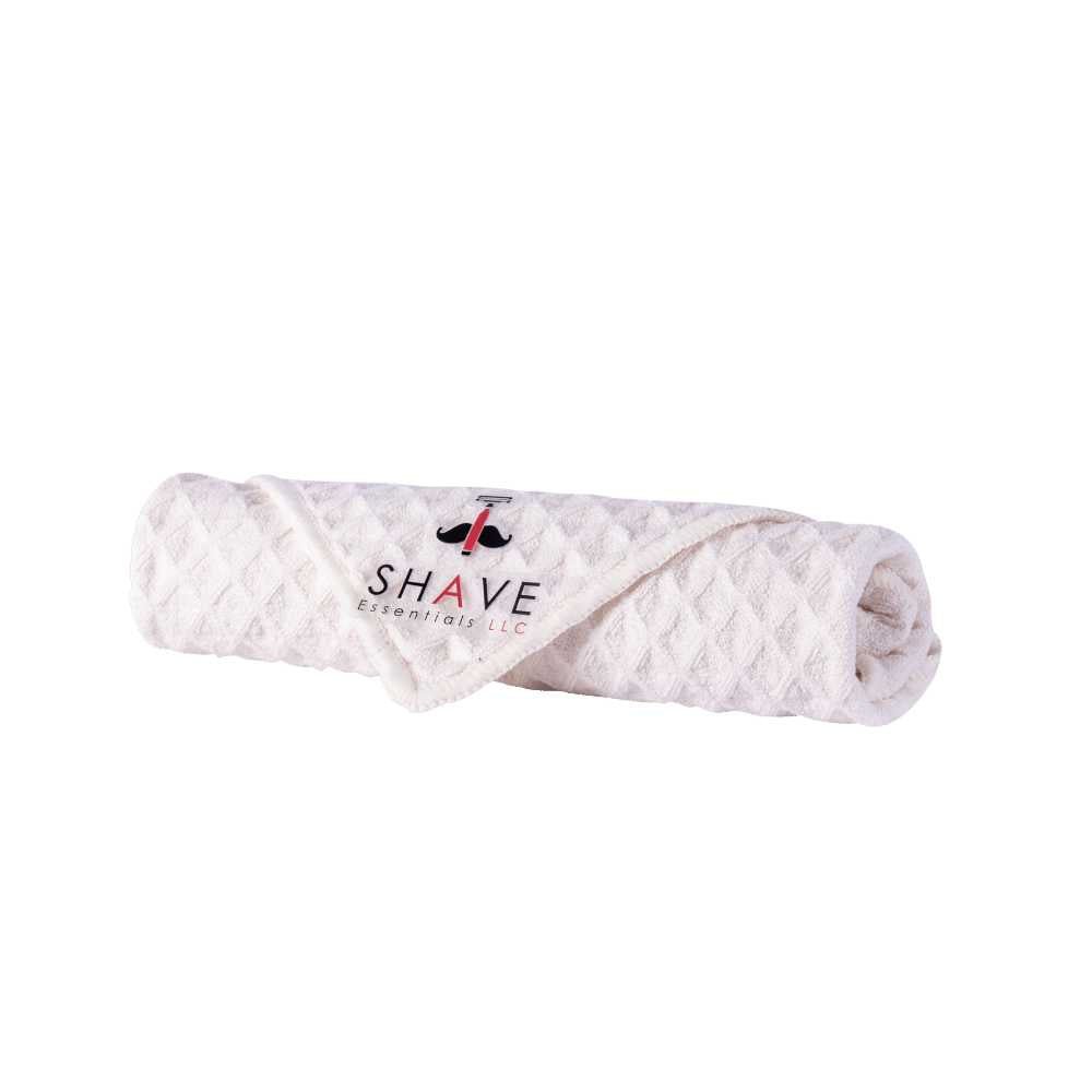 Soft and gentle shave towel designed for optimal skin preparation before shaving, featuring a warm and inviting texture.