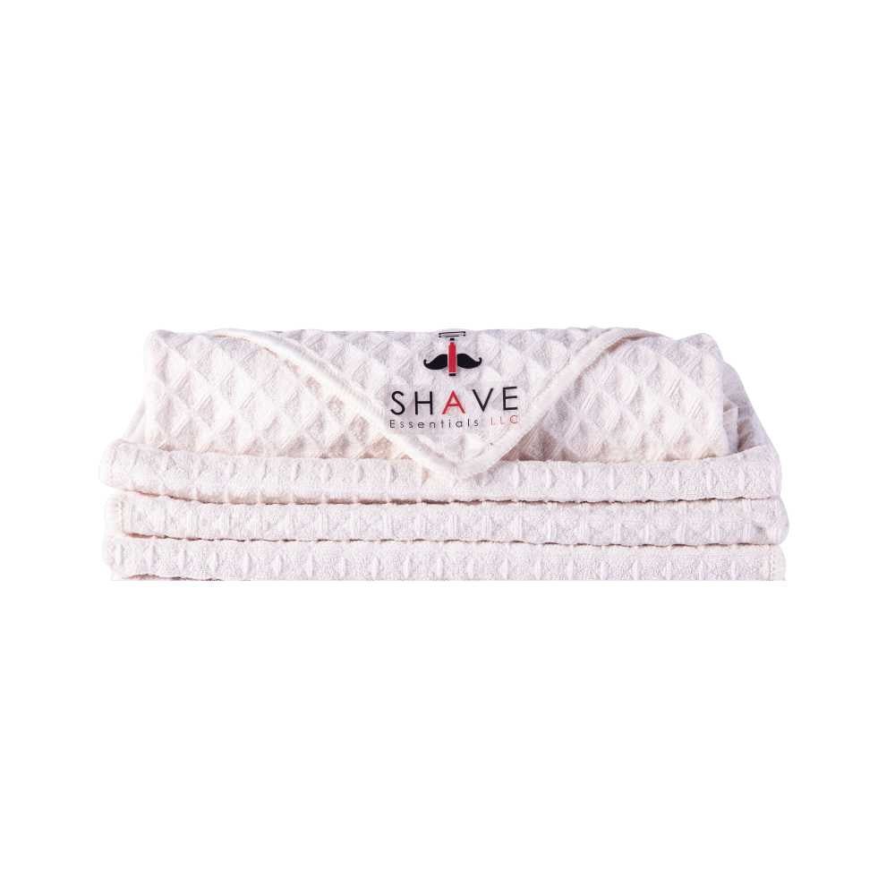 Soft and gentle shave towel designed for optimal skin preparation before shaving, featuring a warm and inviting texture.