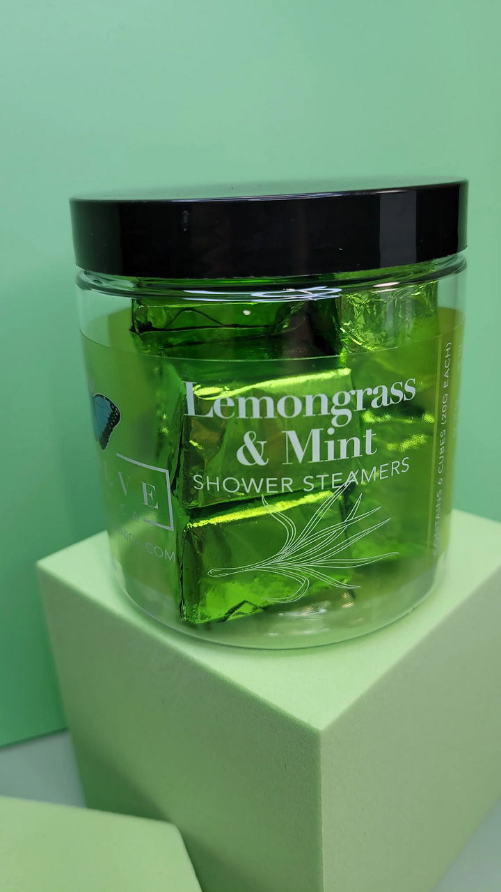 A package of Lemongrass Mint Shower Steamers with six tablets, showcasing their vibrant colors and natural ingredients.