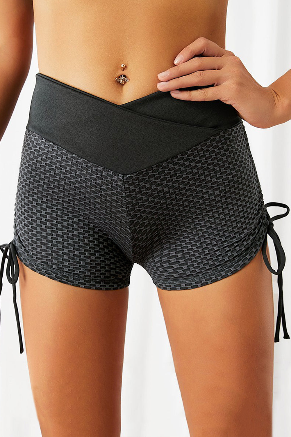 A pair of stylish Side Drawstring Anti Cellulite High Waist Scrunch Butt Lift Shorts in a vibrant color, showcasing the scrunch design and drawstring feature.