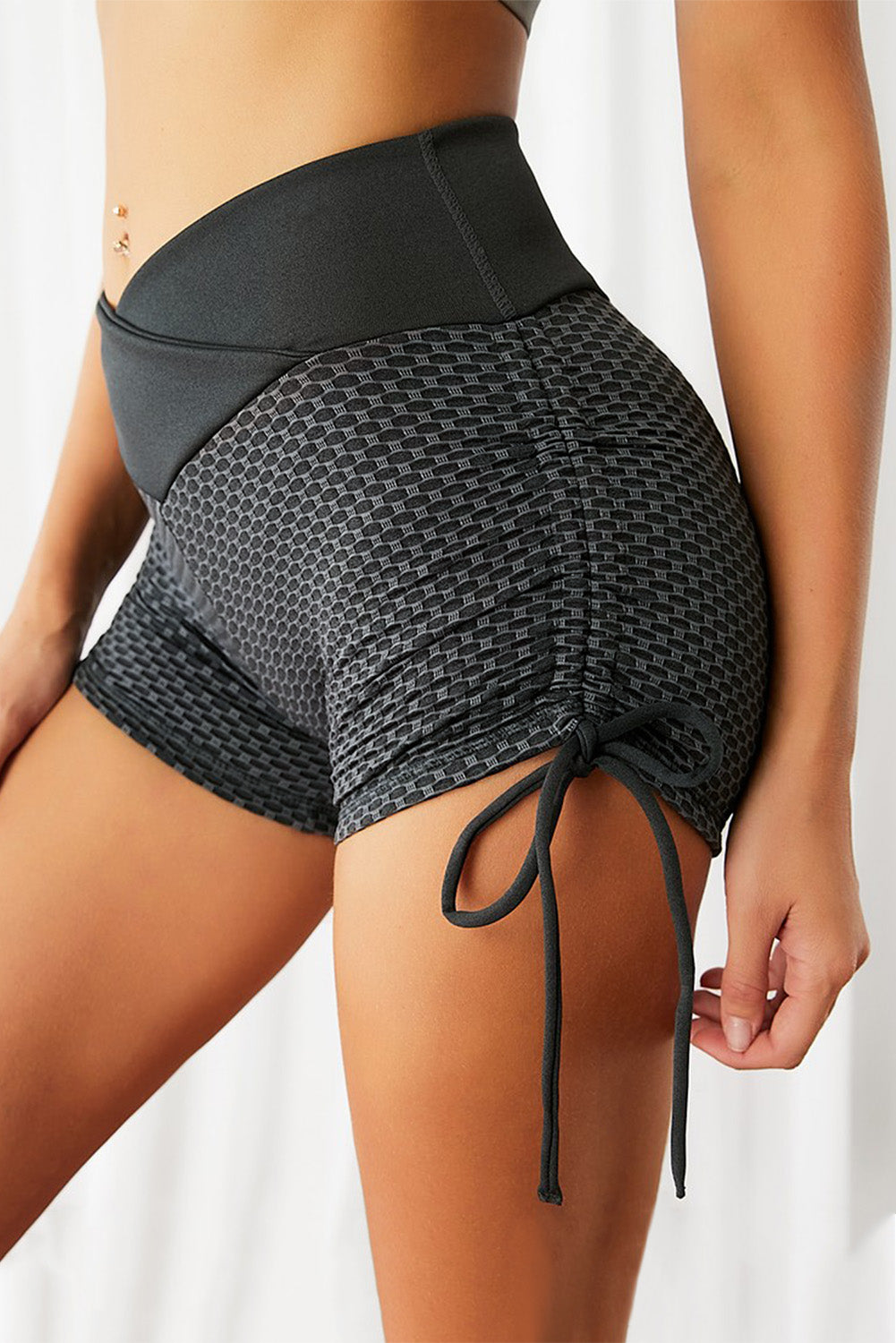 A pair of stylish Side Drawstring Anti Cellulite High Waist Scrunch Butt Lift Shorts in a vibrant color, showcasing the scrunch design and drawstring feature.