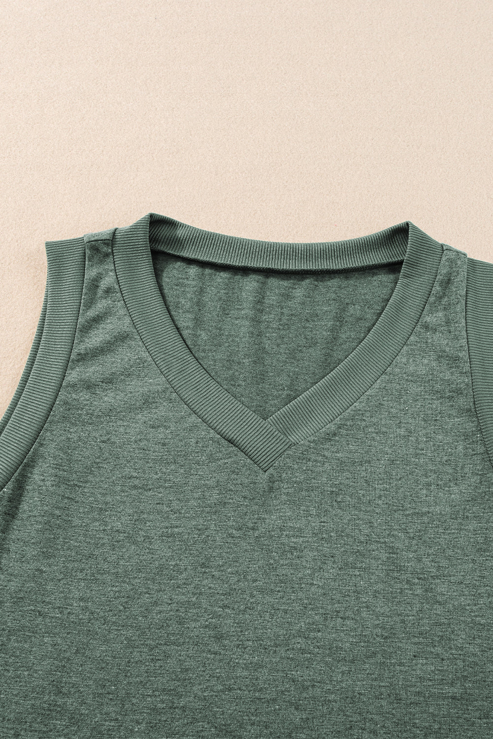 Simply Taupe Ribbed V Neck Tank top displayed on a mannequin, showcasing its stylish design and soft ribbed texture.