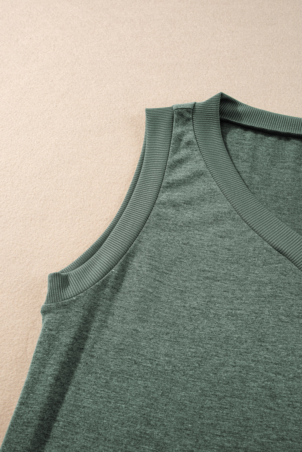 Simply Taupe Ribbed V Neck Tank top displayed on a mannequin, showcasing its stylish design and soft ribbed texture.