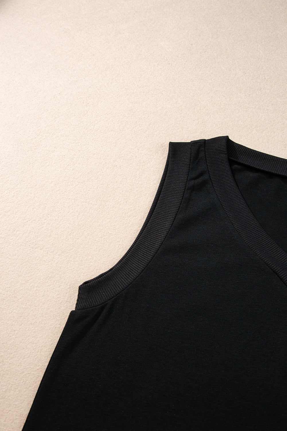 Simply Taupe Ribbed V Neck Tank top displayed on a mannequin, showcasing its stylish design and soft ribbed texture.