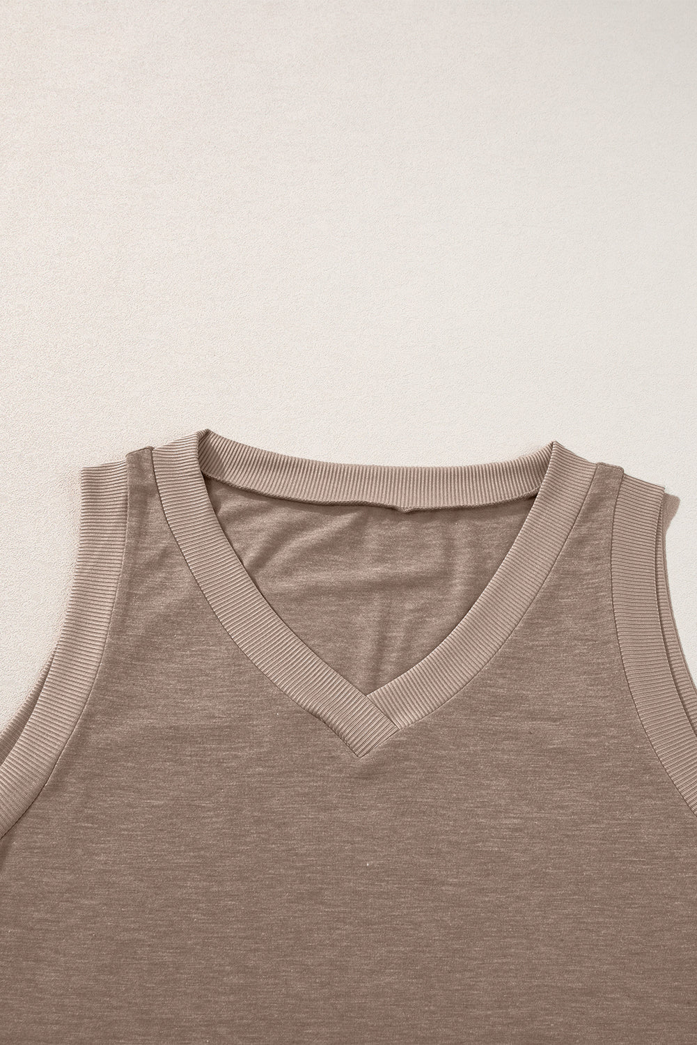 Simply Taupe Ribbed V Neck Tank top displayed on a mannequin, showcasing its stylish design and soft ribbed texture.