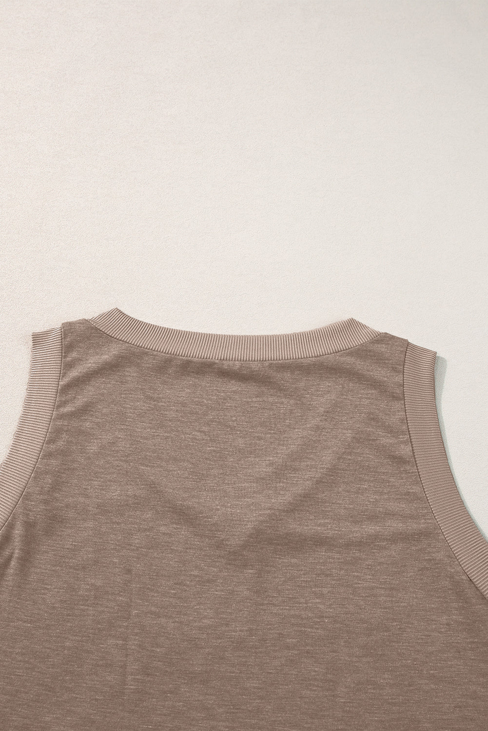 Simply Taupe Ribbed V Neck Tank top displayed on a mannequin, showcasing its stylish design and soft ribbed texture.