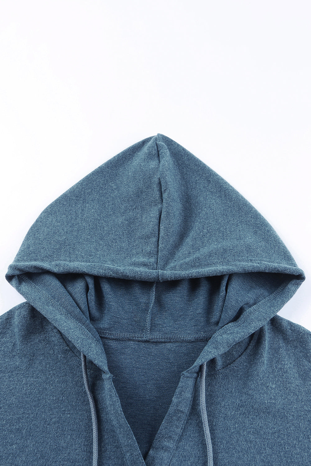 Sky Blue Buttoned High and Low Hem Hoodie with drawstring hood and tortoiseshell buttons, showcasing a relaxed fit and side slits.