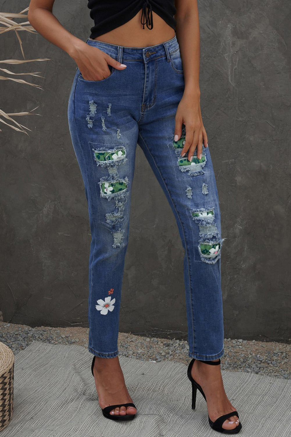 Sky Blue Floral Leopard Print Patchwork Distressed High Waist Jeans showcasing floral and leopard patterns with a trendy distressed look.