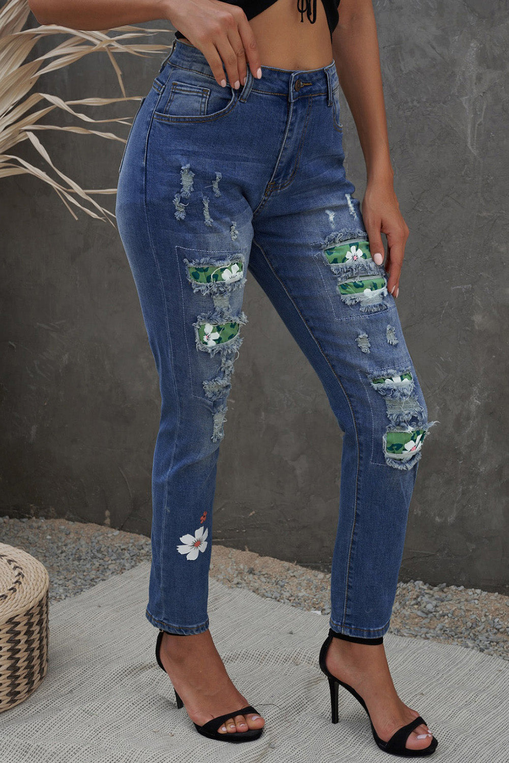 Sky Blue Floral Leopard Print Patchwork Distressed High Waist Jeans showcasing floral and leopard patterns with a trendy distressed look.