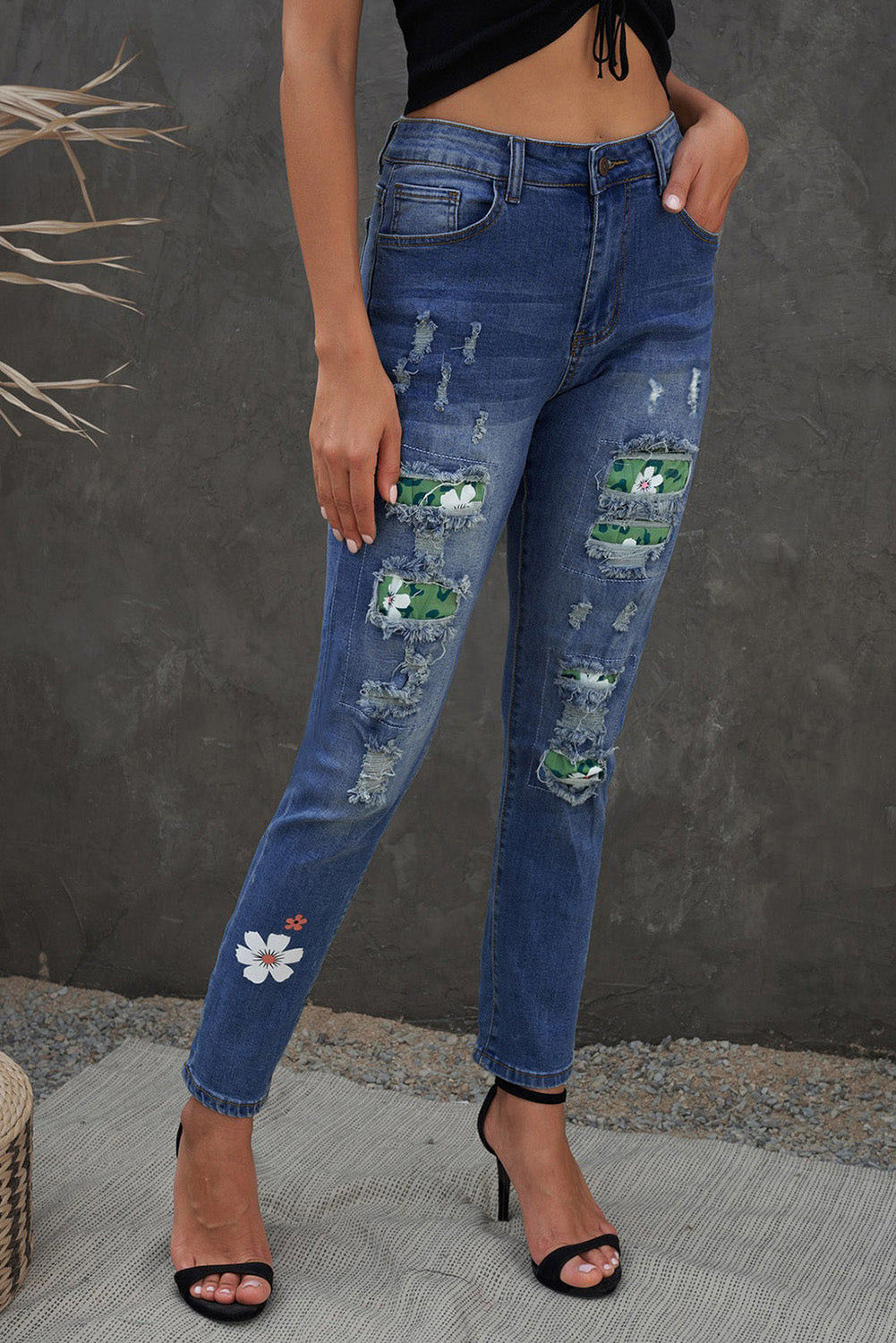 Sky Blue Floral Leopard Print Patchwork Distressed High Waist Jeans showcasing floral and leopard patterns with a trendy distressed look.