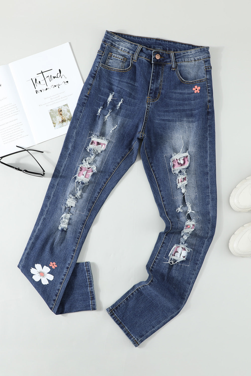 Sky Blue Floral Leopard Print Patchwork Distressed High Waist Jeans showcasing floral and leopard patterns with a trendy distressed look.