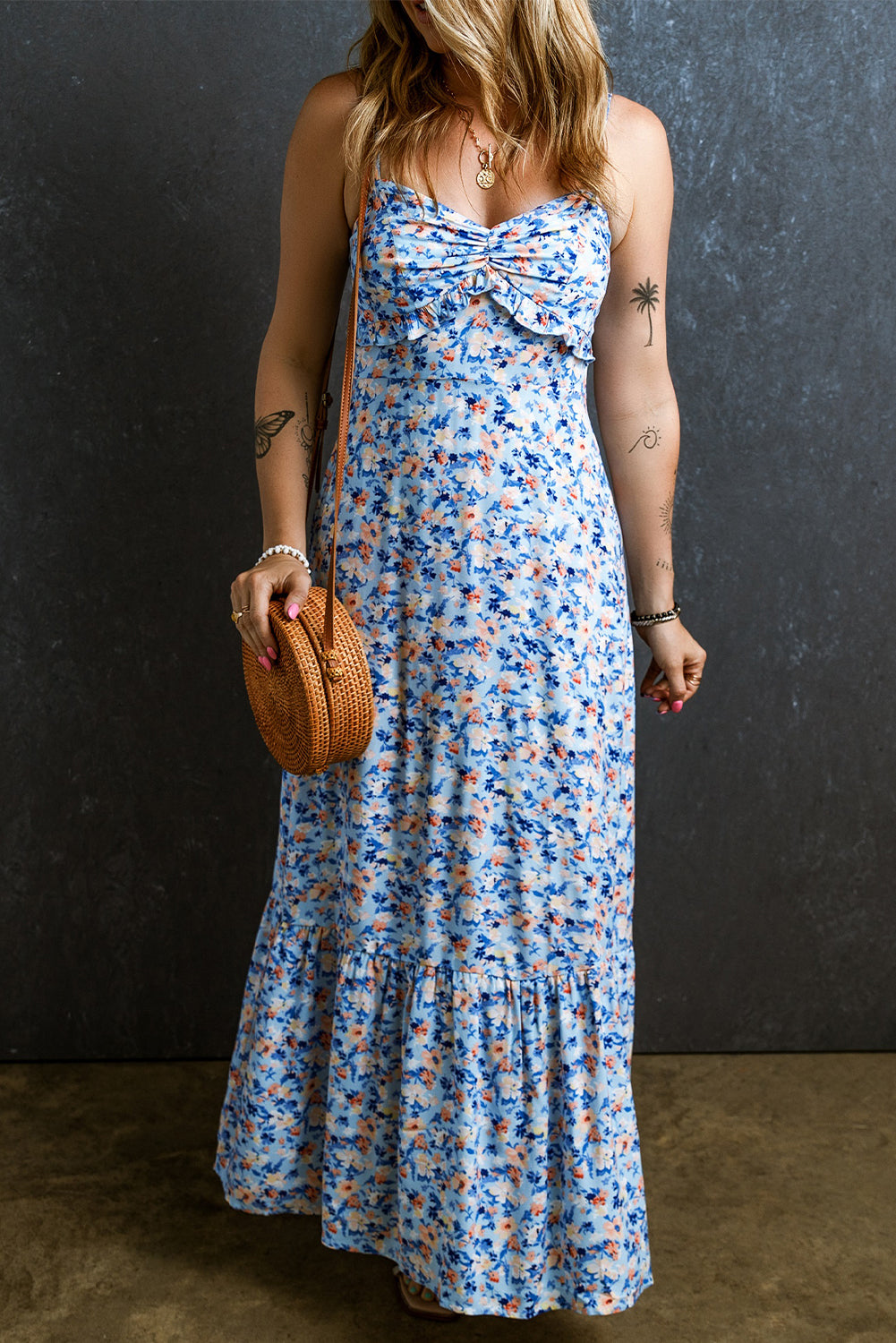 Sky Blue Floral Print Ruffled Ruched Maxi Dress displayed on a mannequin, showcasing its elegant design and vibrant floral pattern.