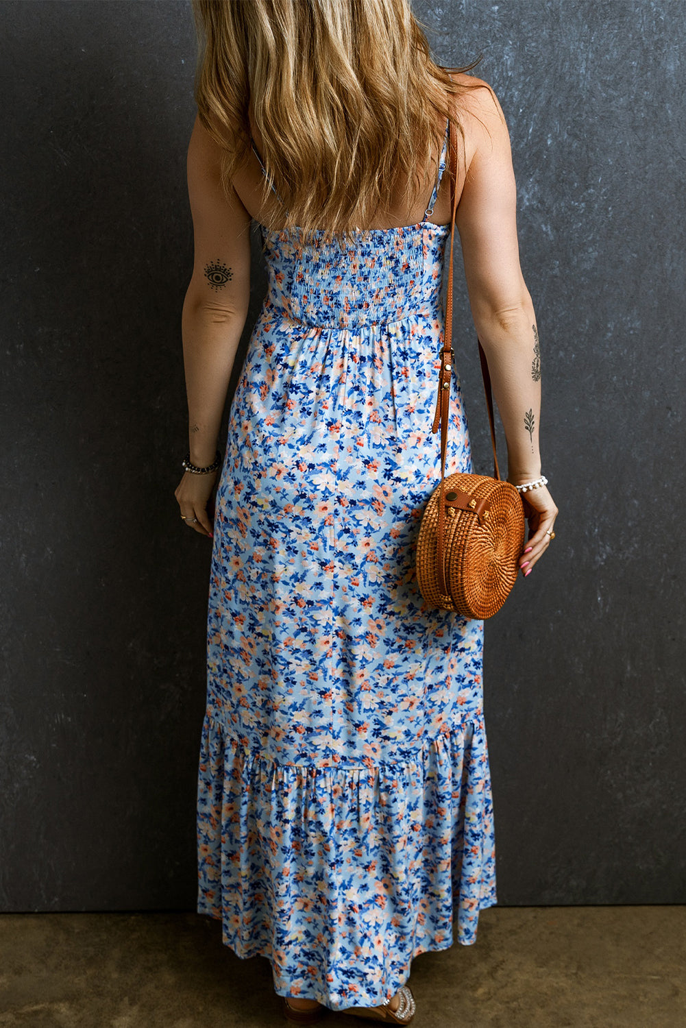 Sky Blue Floral Print Ruffled Ruched Maxi Dress displayed on a mannequin, showcasing its elegant design and vibrant floral pattern.