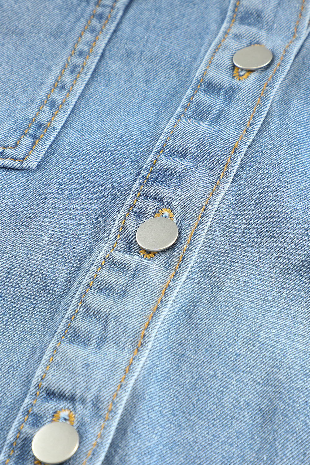 Sky blue denim jacket featuring a raw hem, button closure, and flap pocket, perfect for casual wear.