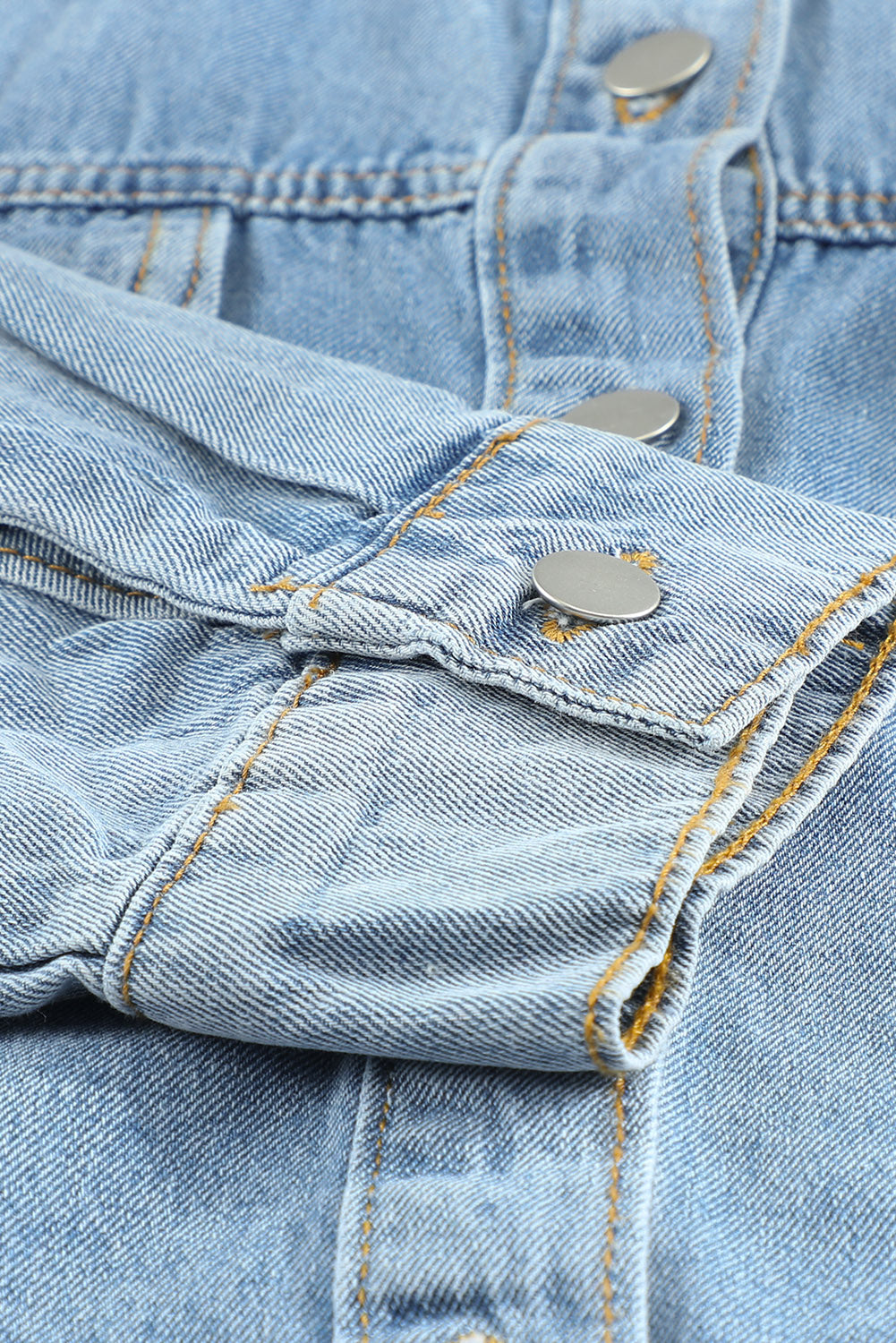 Sky blue denim jacket featuring a raw hem, button closure, and flap pocket, perfect for casual wear.