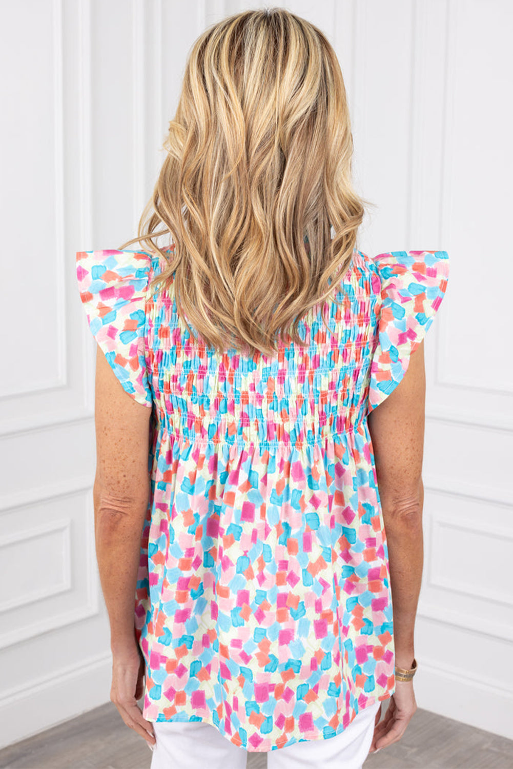 Sky Blue Shirred Yoke Ruffled Blouse with Abstract Print, showcasing elegant ruffles and a stylish design.