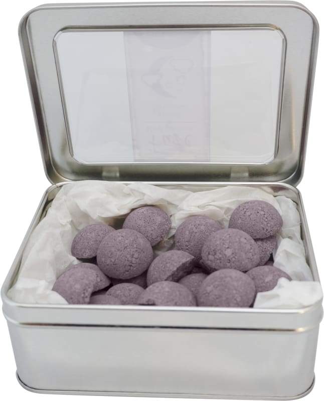 A pack of 25 Sleep Shower Smoothies featuring essential oils for a soothing shower experience, displayed with a loofah bag.