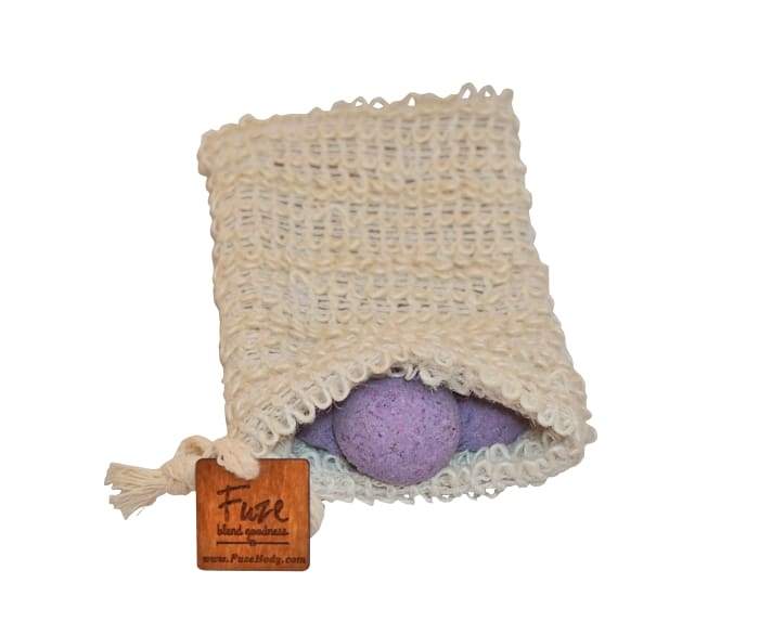 A pack of 25 Sleep Shower Smoothies featuring essential oils for a soothing shower experience, displayed with a loofah bag.