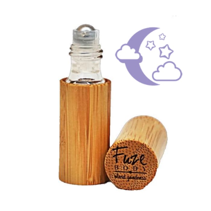 A roll-on bottle of Sleep - Wood Roll-On Pure Essential Oils with a calming design, perfect for promoting restful sleep.