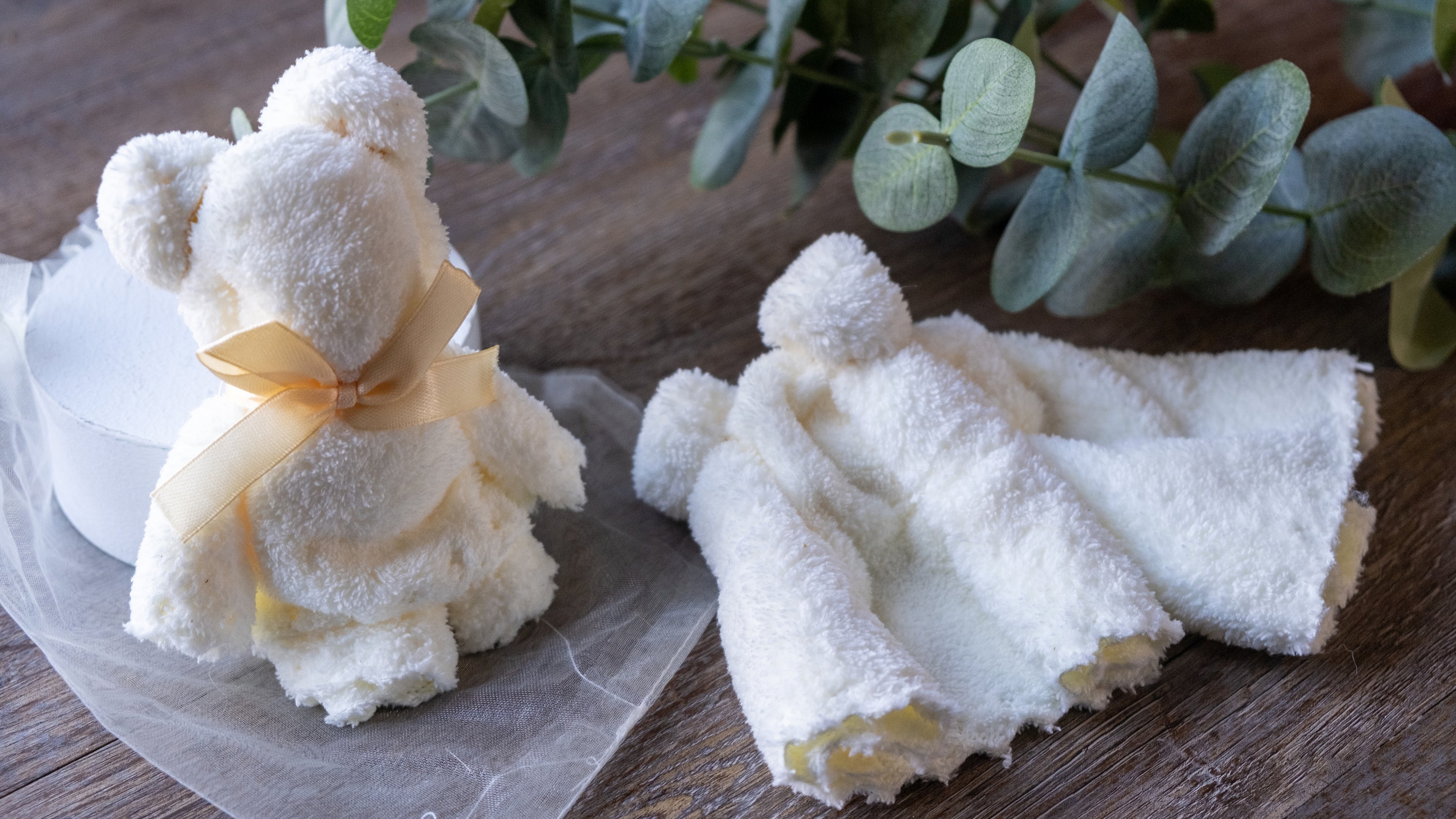 Small White Bear Towel folded into a cute bear shape, made of soft coral fleece, perfect for gifts.