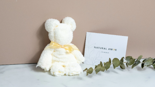 Small White Bear Towel folded into a cute bear shape, made of soft coral fleece, perfect for gifts.