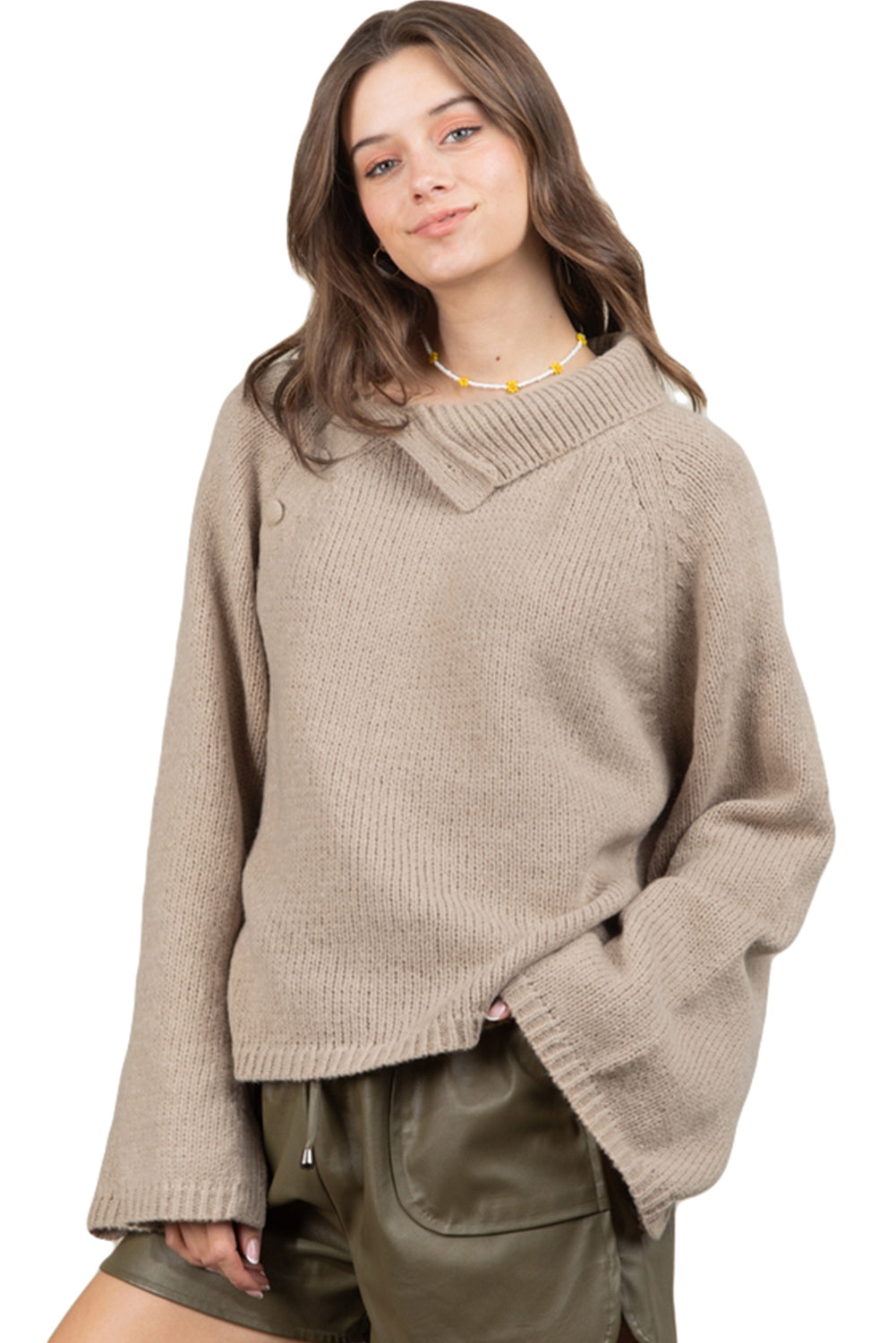 Smoke gray sweater with wide sleeves and high neck, featuring side buttons for adjustable styling.