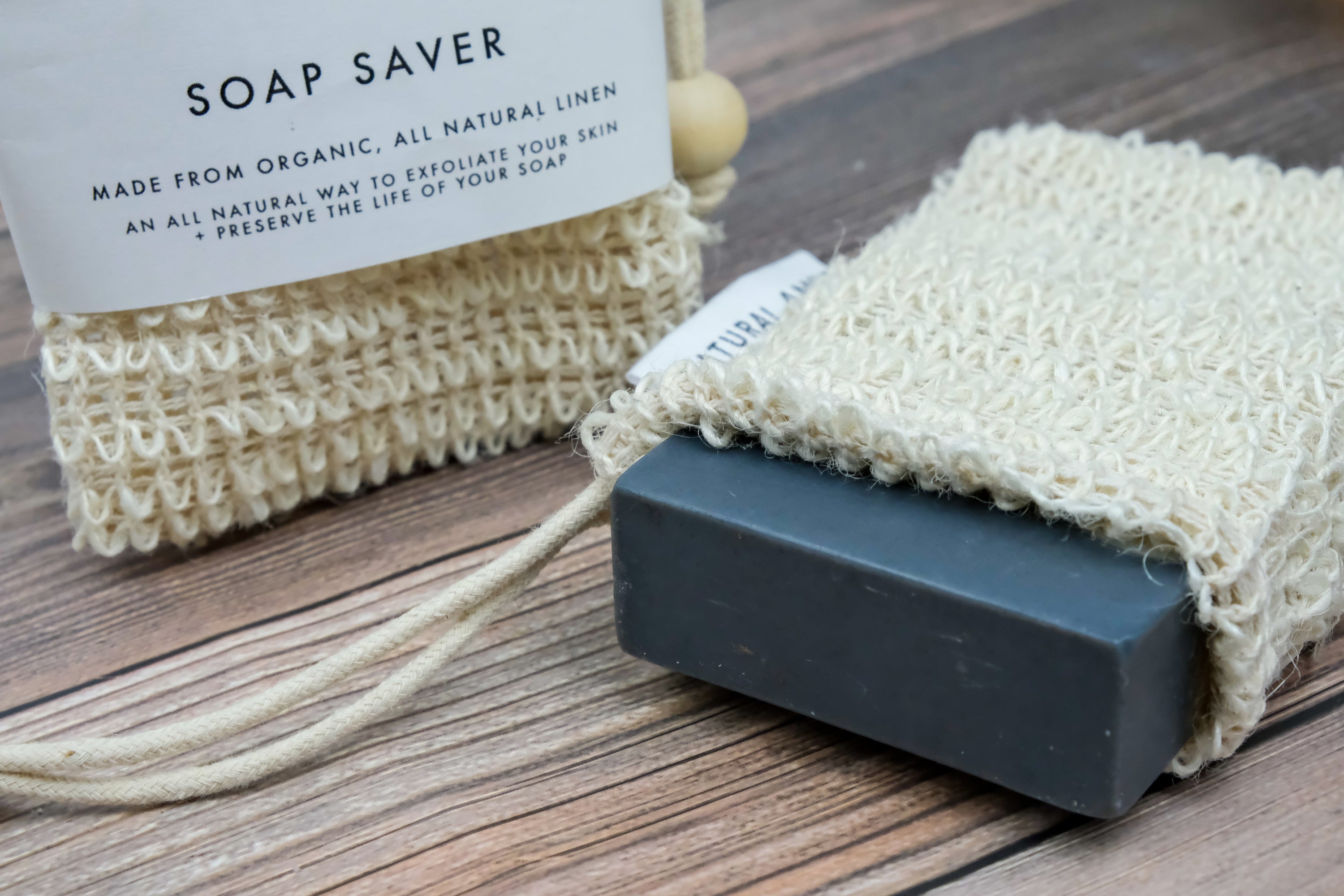 Natural Amor Soap Saver Net made of linen and cotton, designed to hold and dry handmade soap bars, preventing sogginess.