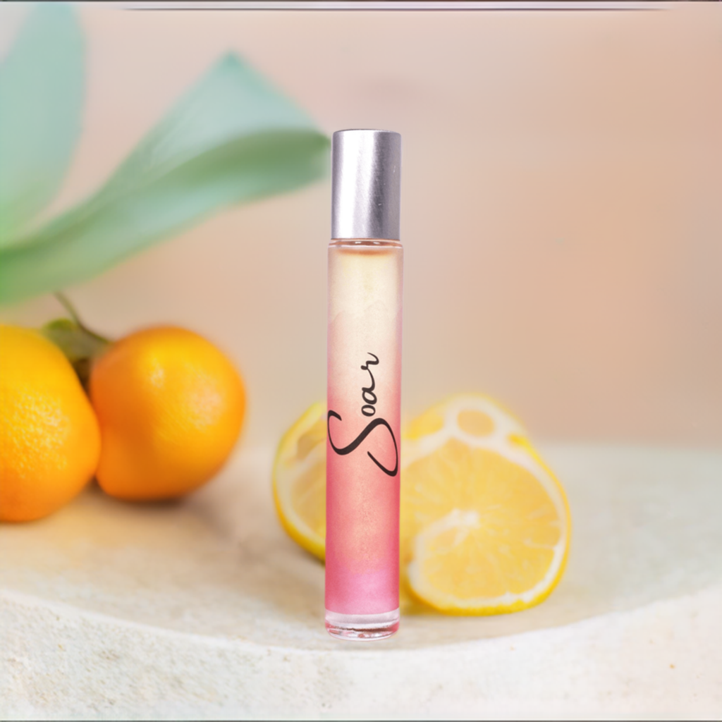 Soar Rollerball Perfume in a sleek 10 ml bottle with a rollerball applicator, featuring a vibrant citrus and musk scent.