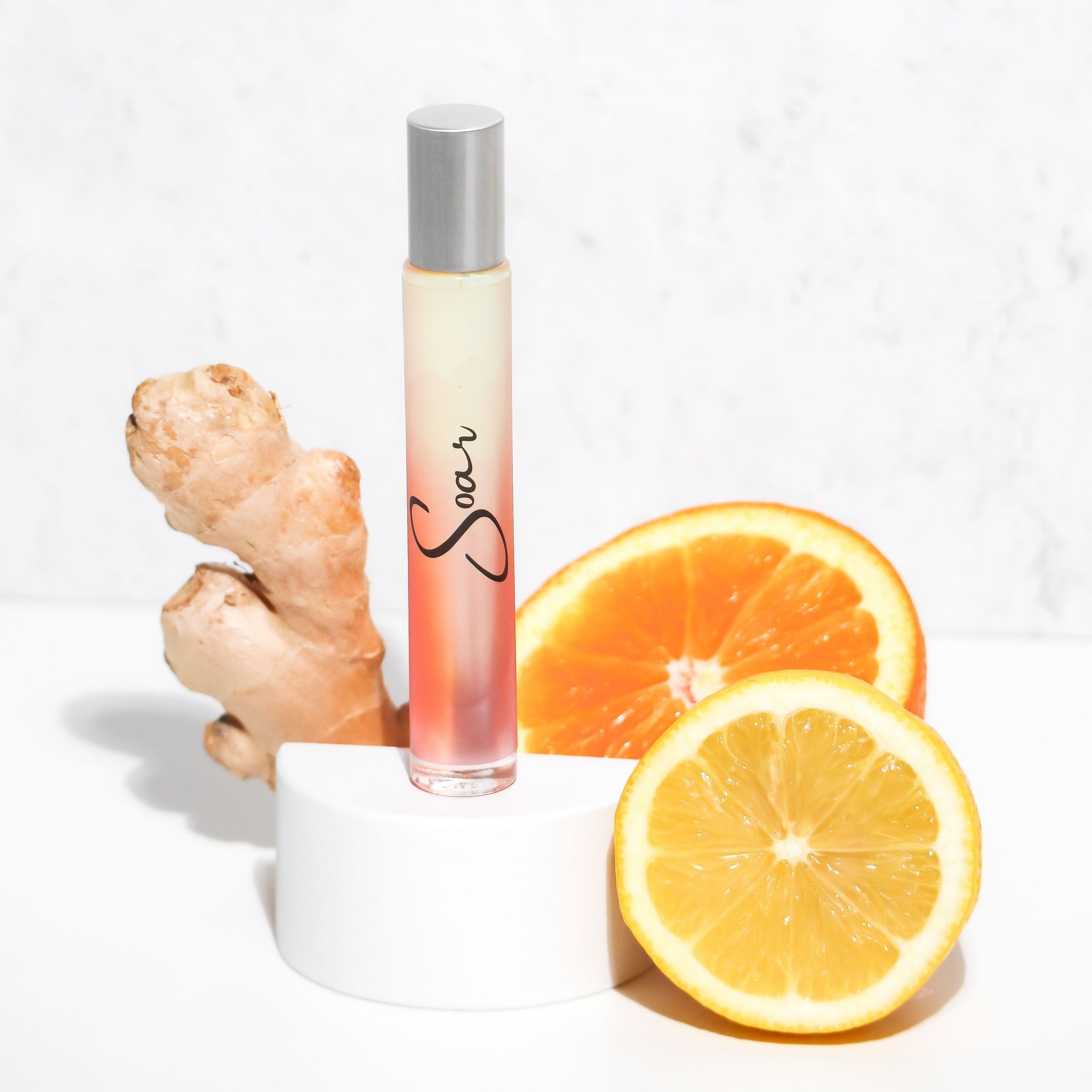 Soar Rollerball Perfume in a sleek 10 ml bottle with a rollerball applicator, featuring a vibrant citrus and musk scent.